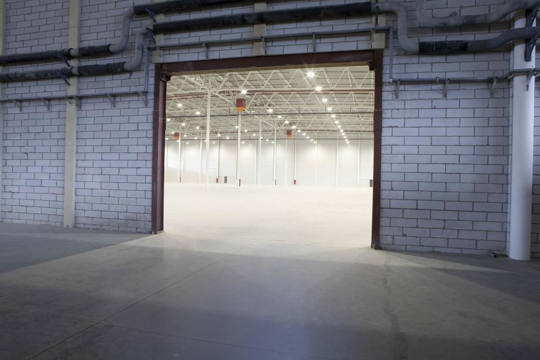 Picture of finished concrete floor on the inside and outside of large industrial building
