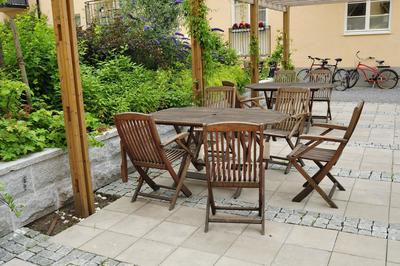 Picture of outdoor table and chairs sitting nicely on stamped concrete patio